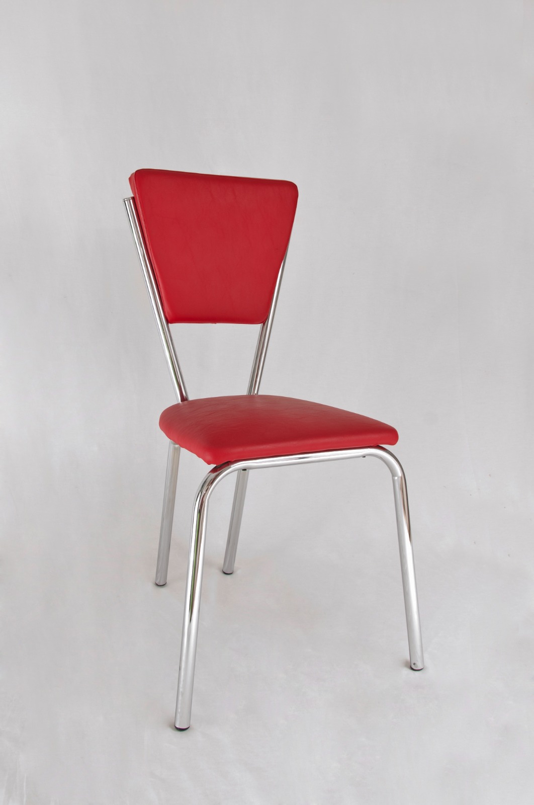 Silla tapizada de cuerina cromada